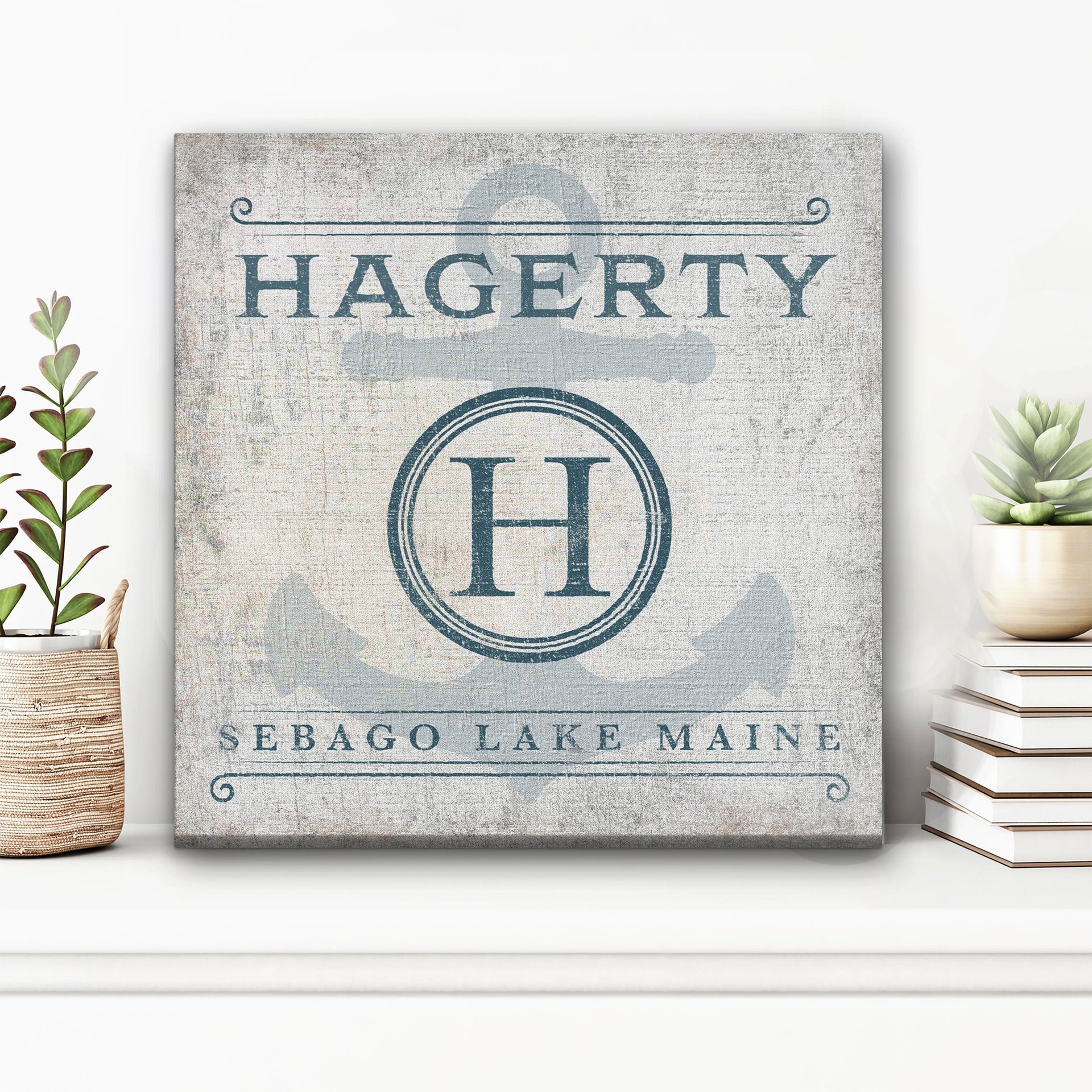 Customized family name anchor monogram wall sign with navy and white coastal aesthetic.