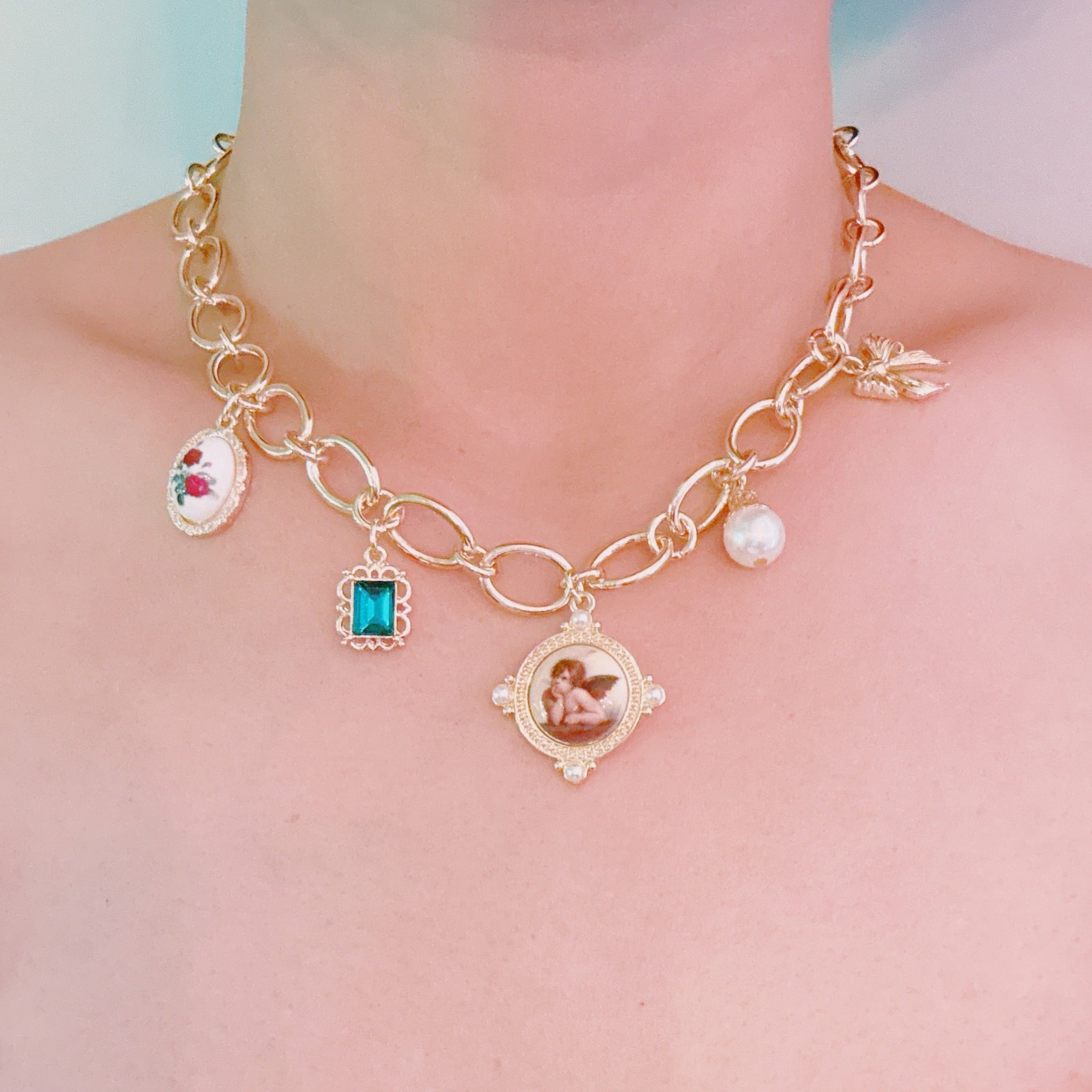 Angel & Rose Charm Necklace – Bold Gold Chain with Whimsical Vintage-Inspired Accents