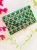 Green synthetic clutch bag with magnetic lock closure, front view