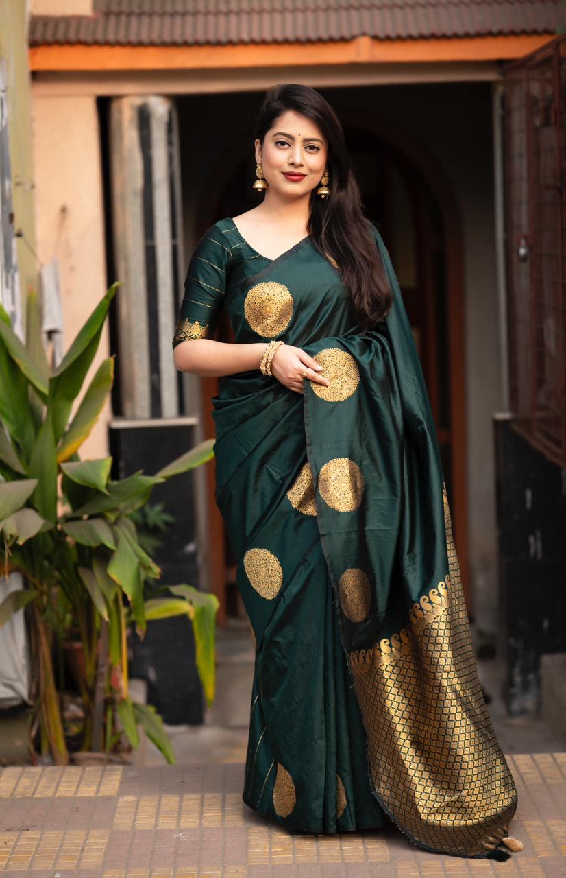 Elegant green silk saree with gold zari woven butta pattern and matching unstitched blouse piece