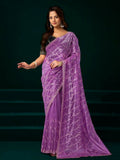 Lavender net party wear saree paired with a black velvet blouse