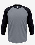 Model wearing a grey and black three-quarter sleeve raglan baseball shirt with a scalloped hem