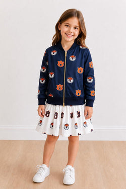 Girl wearing a blue satin Auburn Tigers jacket for game day spirit wear