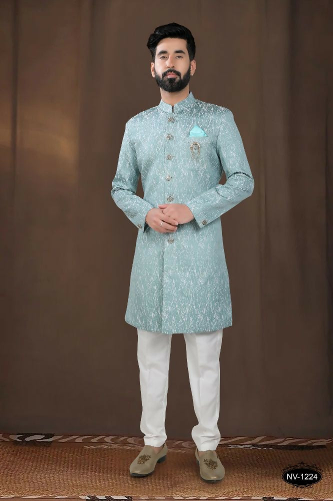 Boys green woven jacquard kurta with self-design pattern and matching polo-style pyjama.