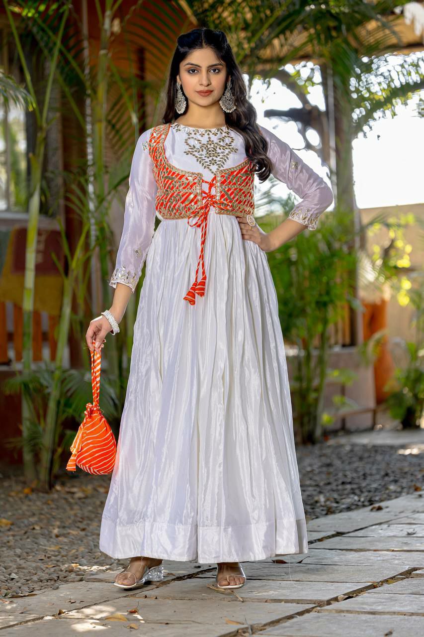 Elegant off-white Chinon silk Anarkali gown with Laheriya print, Gotta Patti work, matching jacket, and hand purse.