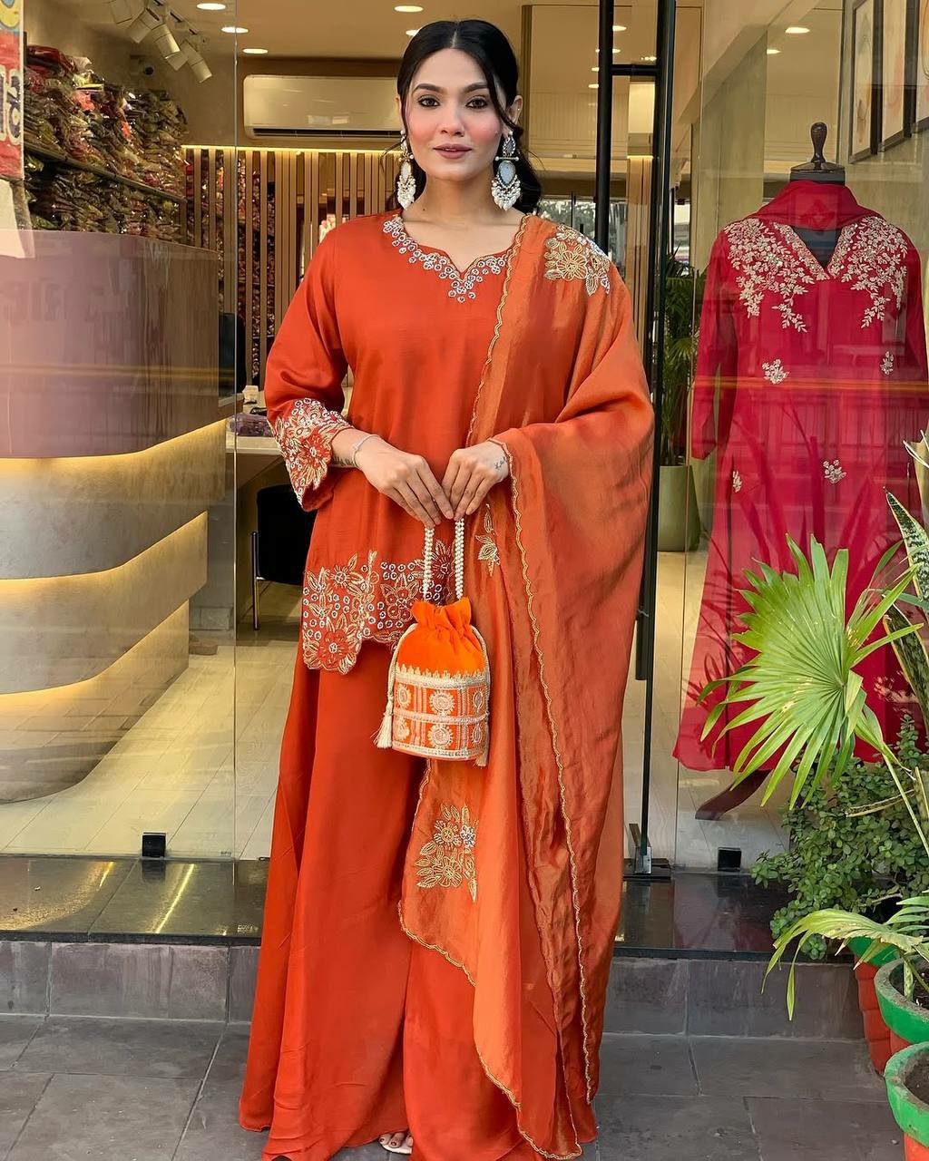 Vibrant orange georgette palazzo suit with embroidery and full sleeves
