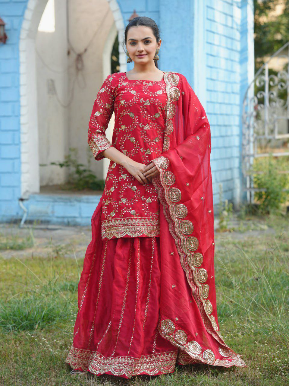 Red Rangoli silk lehenga style suit with intricate embroidery and sequin embellishments