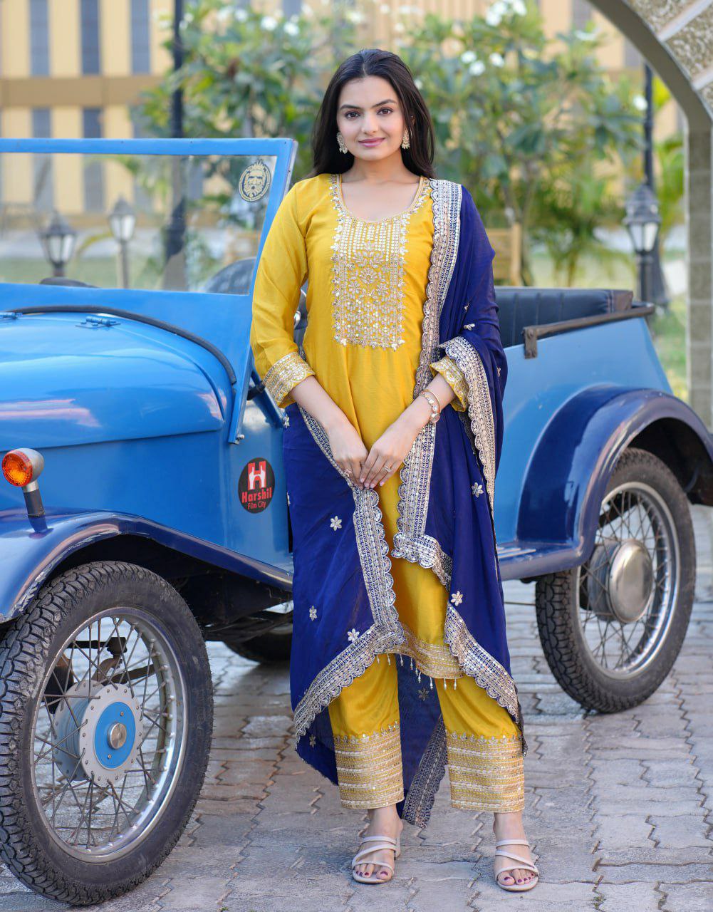 Bright Yellow Chinon Silk Salwar Suit featuring intricate sequence embroidery.