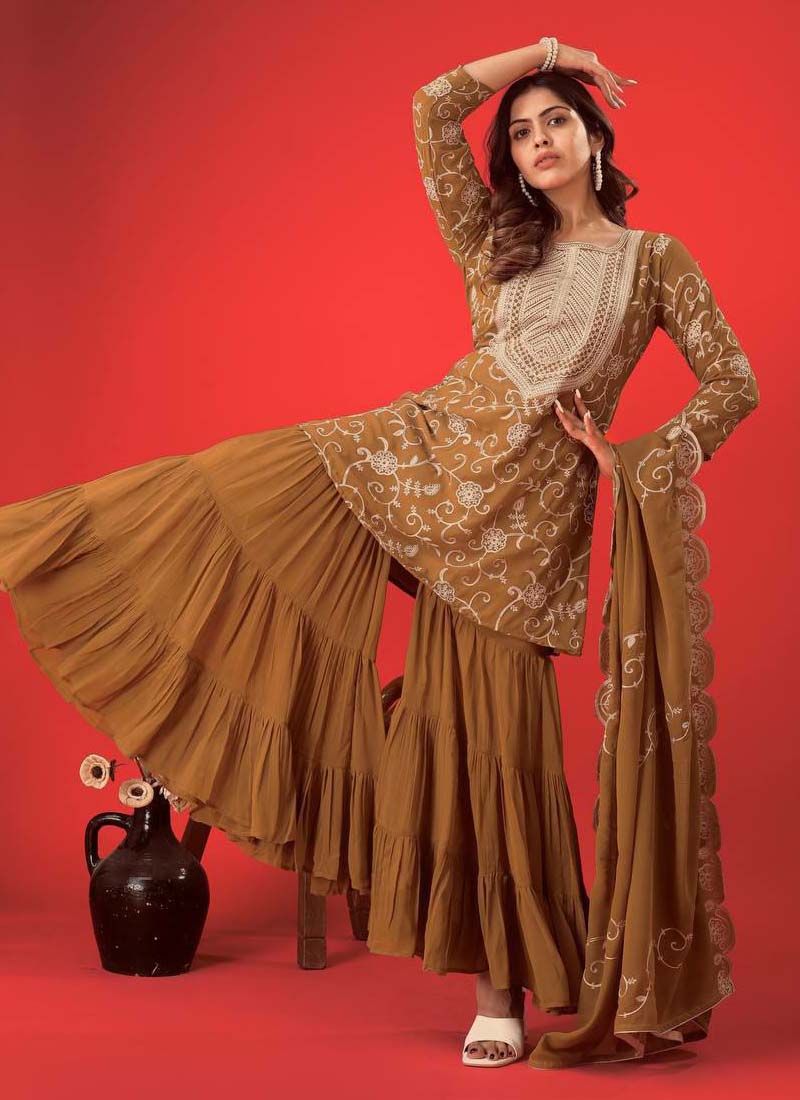 Beige Georgette embroidered sharara suit with long sleeves and detailed ethnic work