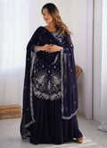 Elegant blue faux georgette sharara suit with intricate sequence and thread embroidery.
