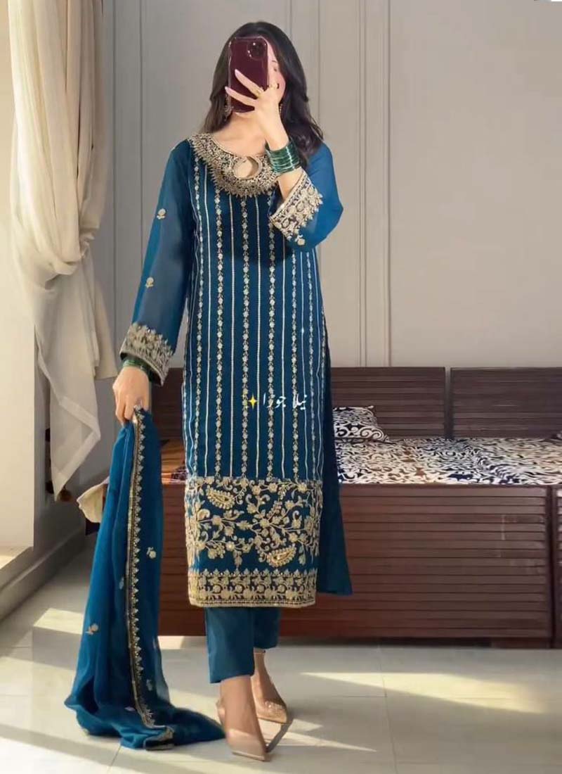 Firozi Chinon Silk Salwar Suit with gold embroidery and sequence work, displayed in a traditional Indian aesthetic.
