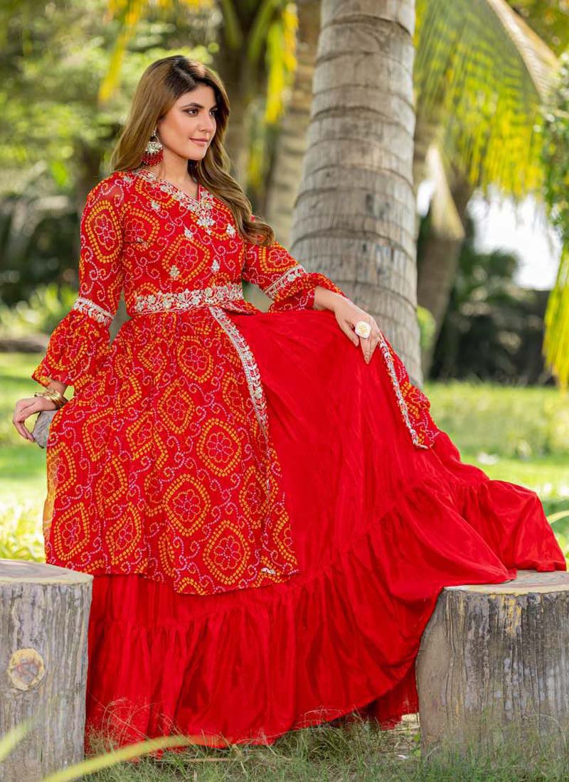 Red and pink Bandhej embroidered top paired with a matching festive lehenga skirt