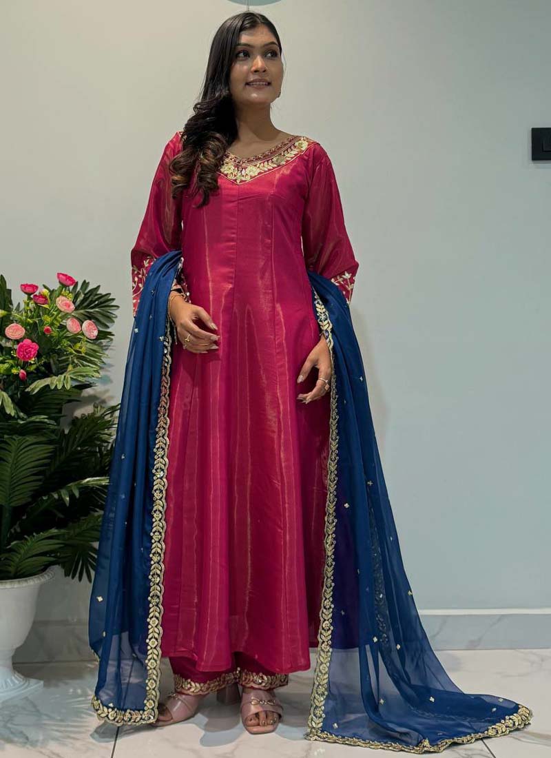 Rani pink Roman silk Anarkali suit with heavy embroidery and flared gown silhouette