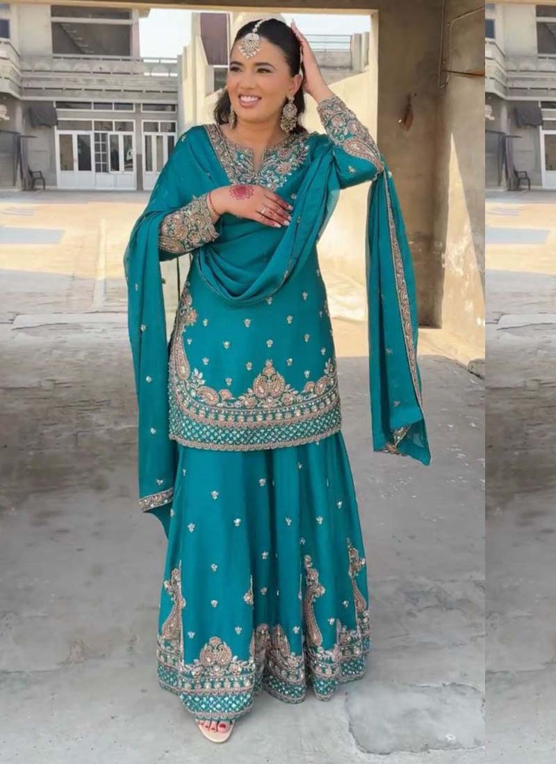 Turquoise Chinon silk palazzo suit with heavy intricate embroidery.