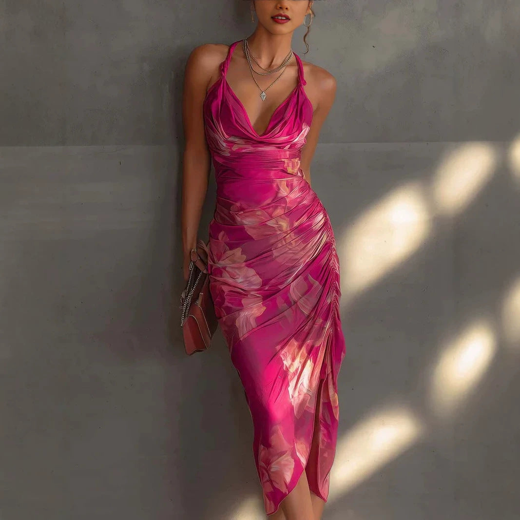 Glamorous carmine red backless halter maxi dress with floral print and high-slit.