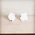 Handmade white howlite turquoise slab stud earrings featuring raw stone texture and brass-tone backings