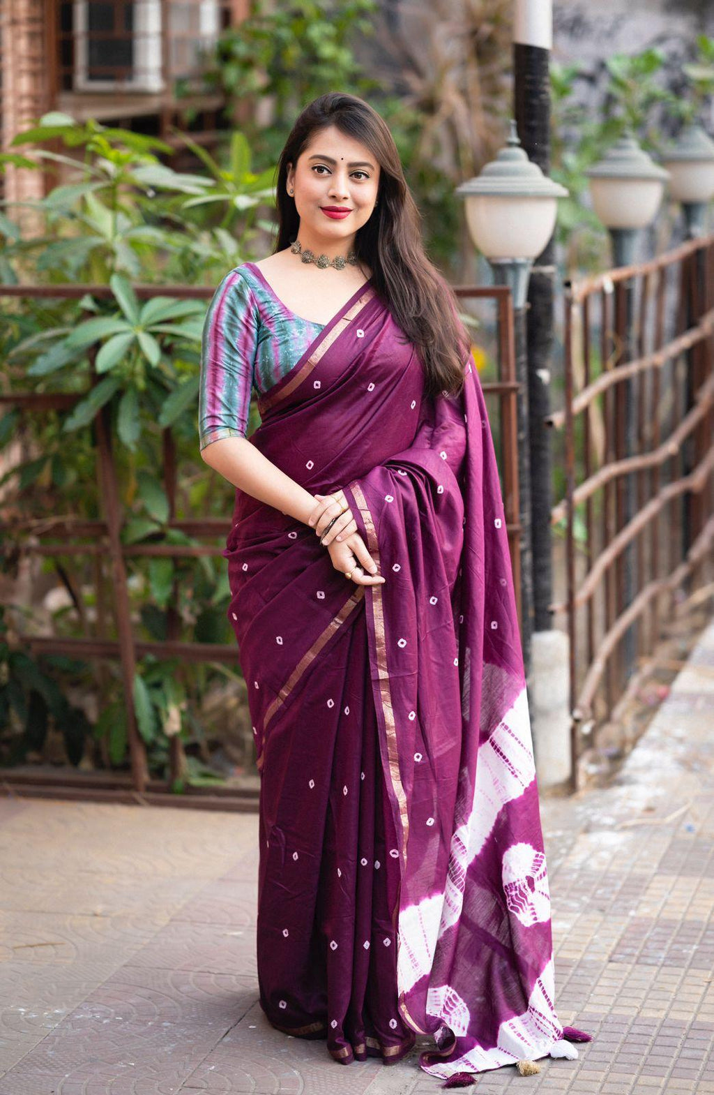 A purple Chanderi cotton saree featuring intricate block print patterns with an unstitched blouse piece.