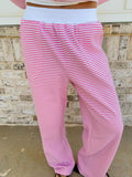 Unisex dark pink and white striped sweatpants with a relaxed, comfortable fit.