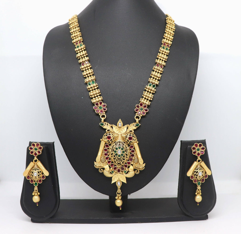 Close-up view of a Rajwadi polish brass necklace featuring intricate stone embellishments.