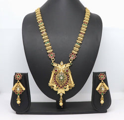 Close up of Rajwadi polish brass necklace set with intricate stone embellishments