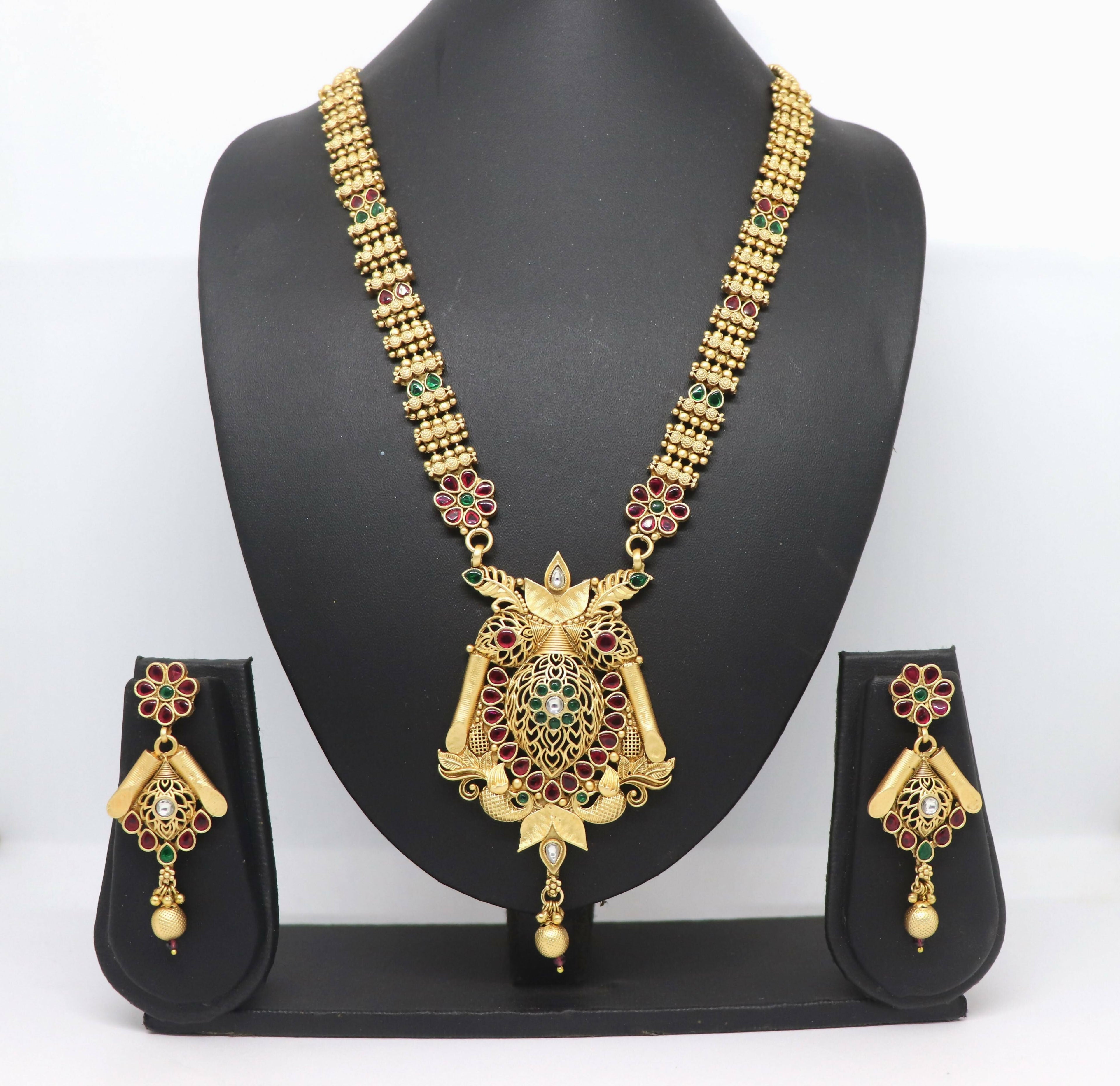 Close-up view of a Rajwadi polish brass necklace featuring intricate stone embellishments.