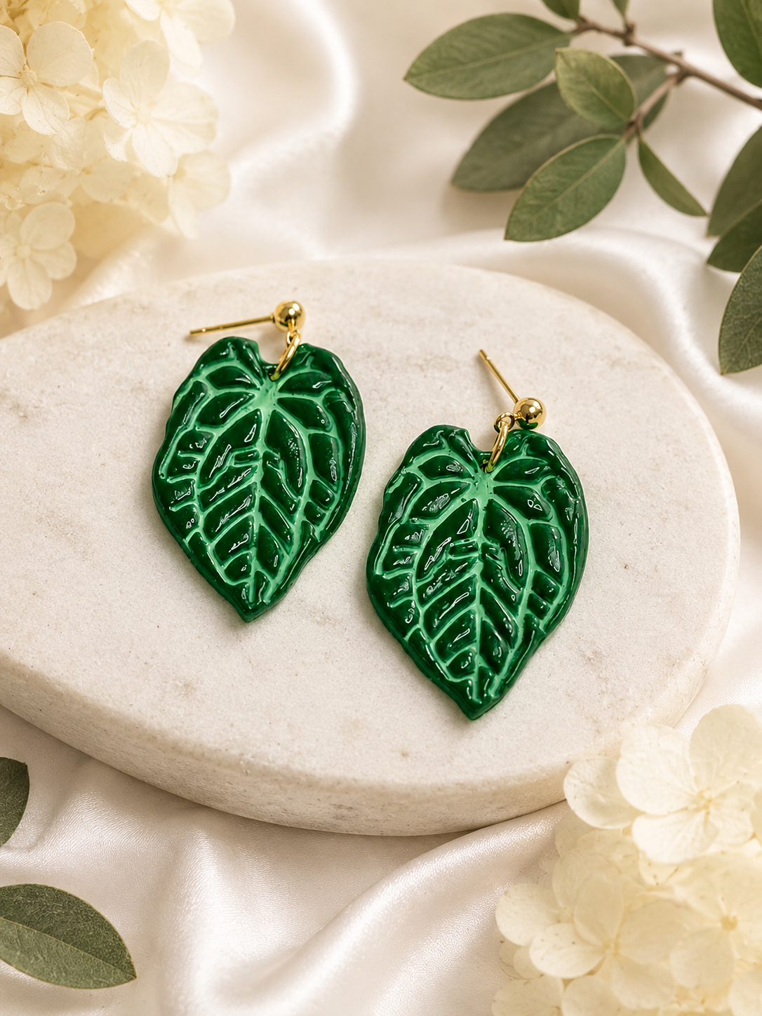 Handcrafted forest green Anthurium Crystallinum leaf earrings with gold accents