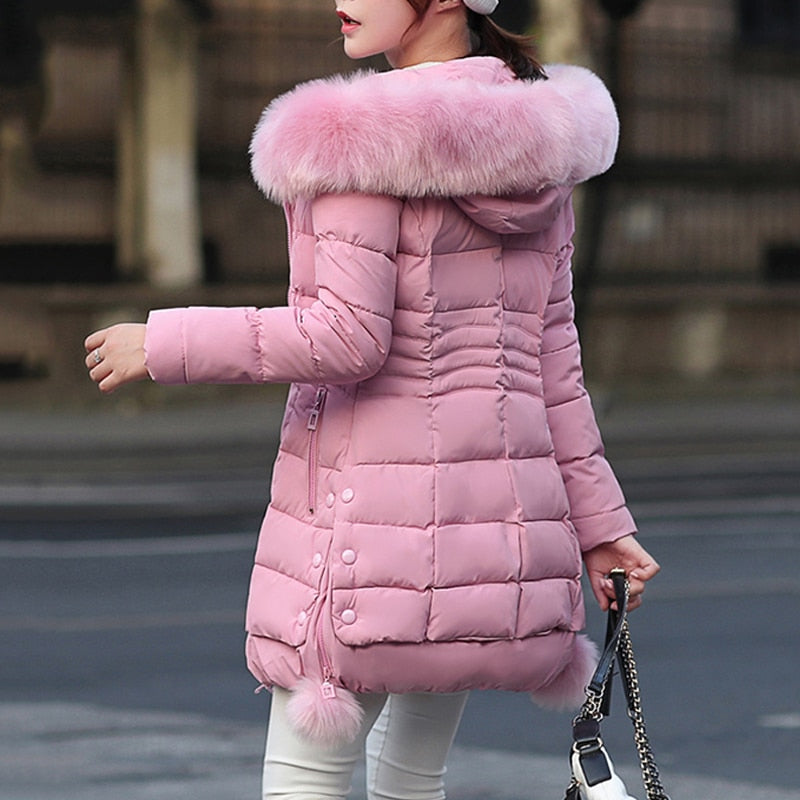 Women's Faux Fur Hooded Quilted Parka in pink or light grey, perfect for winter warmth and style.