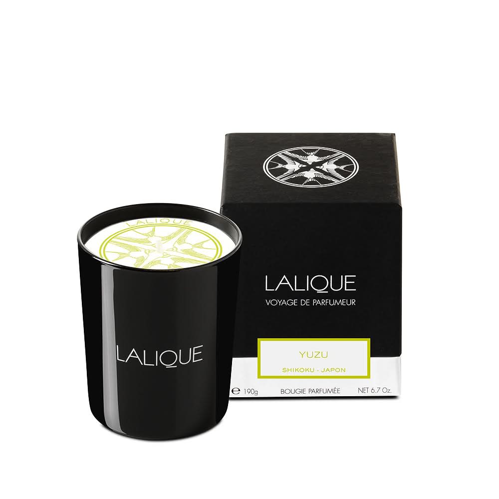 Lalique Yuzu scented candle in black, white, and green glass vessel
