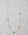 Silver station necklace featuring small round stone accents on a 16-inch chain.