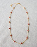 Lucky Me gold-plated cable chain necklace featuring vibrant red enamel clover charms