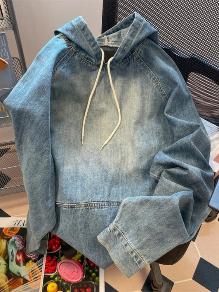 Women's vintage wash denim hoodie with drawstring hood and kangaroo pocket, featuring an oversized fit and Harajuku style.
