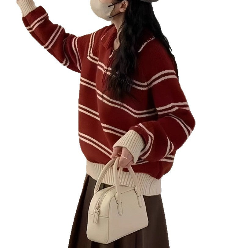 A woman wearing a striped half-zip sweater with a turn-down collar in a soft knit fabric.