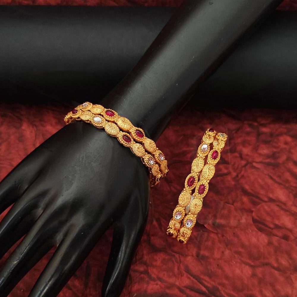 Set of four antique-finish Indian ethnic bangles with intricate traditional patterns
