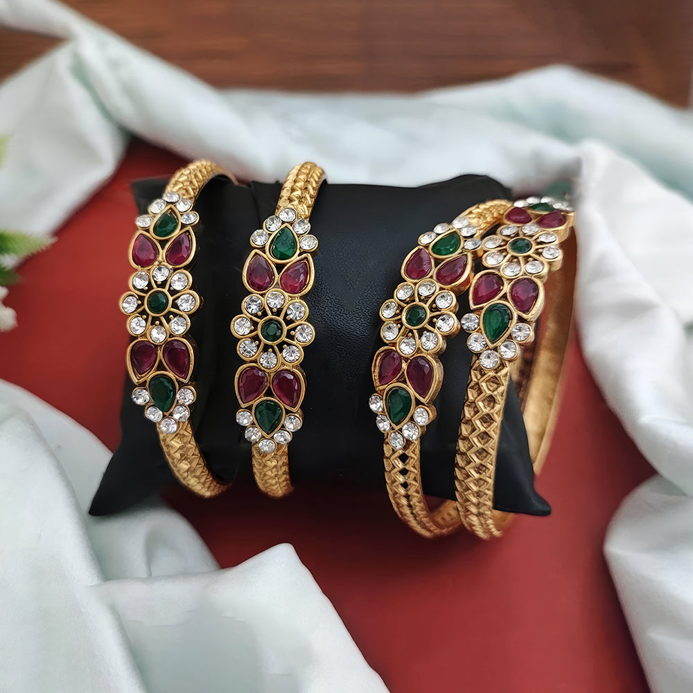 Set of 4 Rajwadi polish bangles with red Kemp stone detailing on a neutral background
