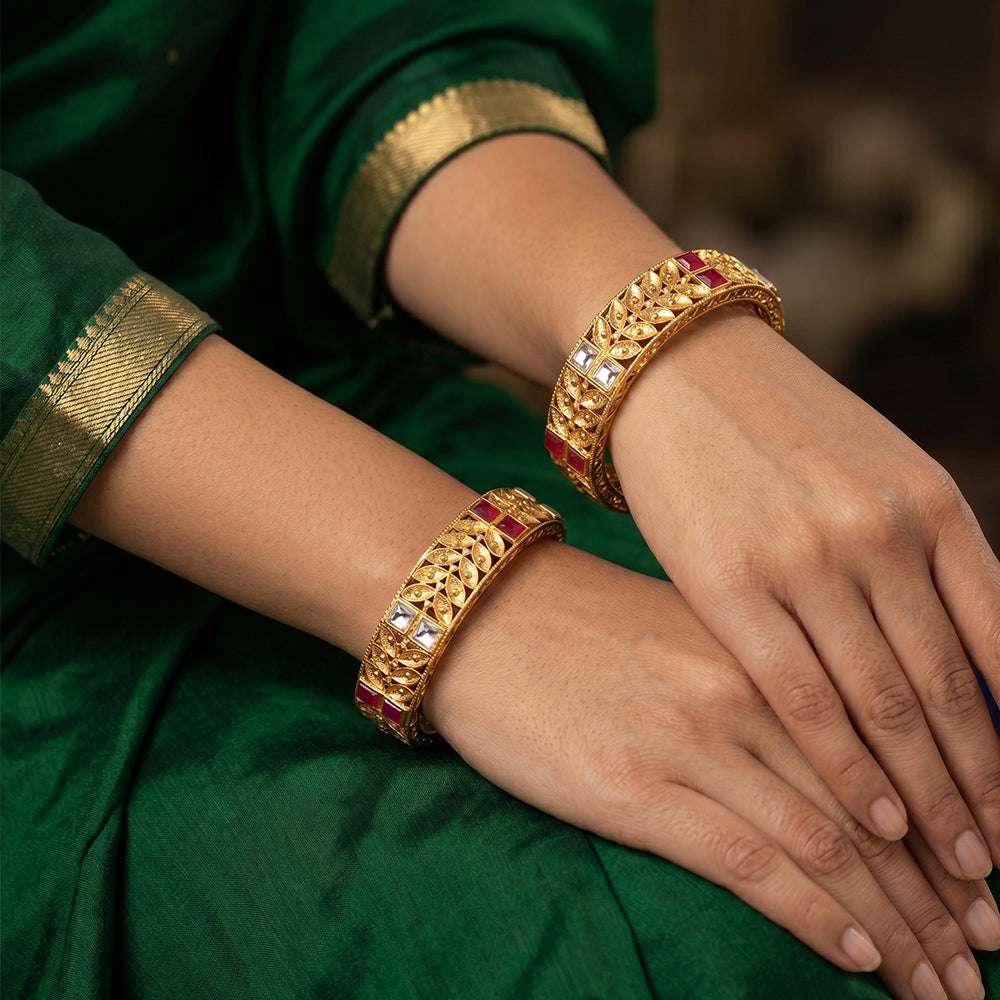 Set of two antique-style Rajwadi polish bangles with intricate traditional detailing.