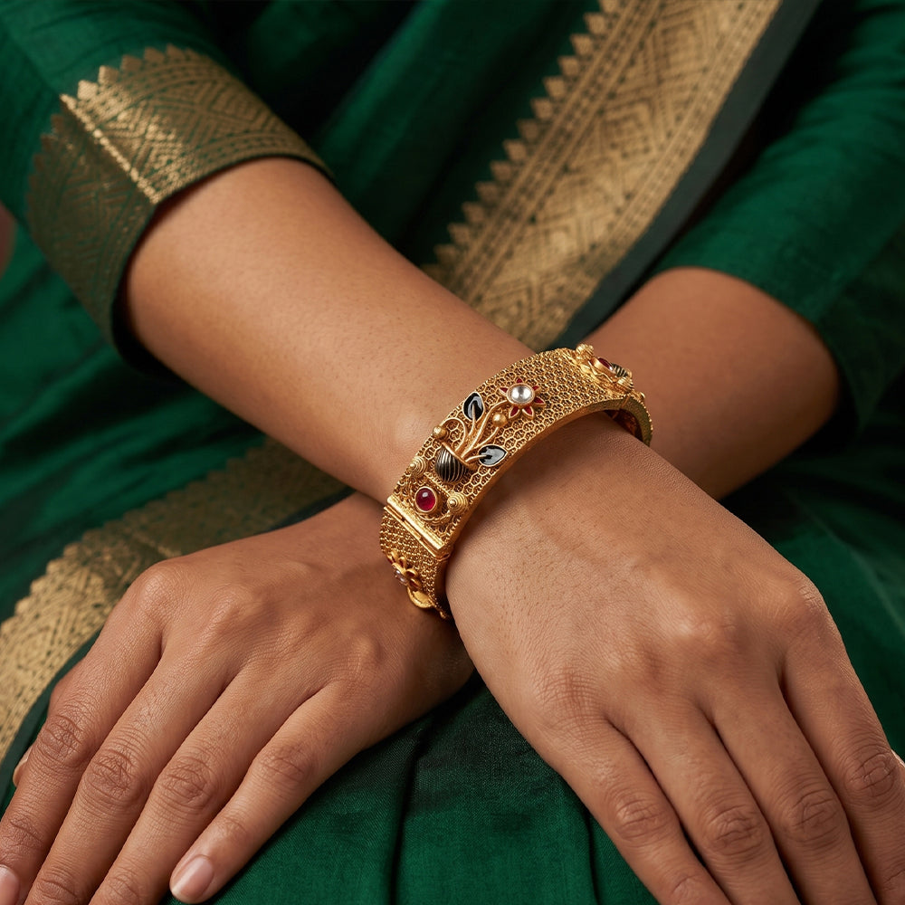 Close up of traditional Rajwadi polish antique gold bangles for women