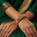 Close up of traditional Rajwadi polish antique gold bangles for women