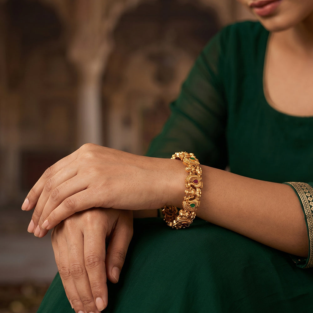Temple Goddess Laxmi and Peacock Design Gold Polish Bangles