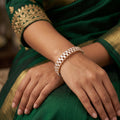 Set of two high gold designer bangles with premium baguette stone accents