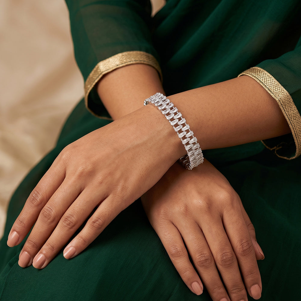 Set of two silver-toned white rhodium bangles featuring rectangular stones