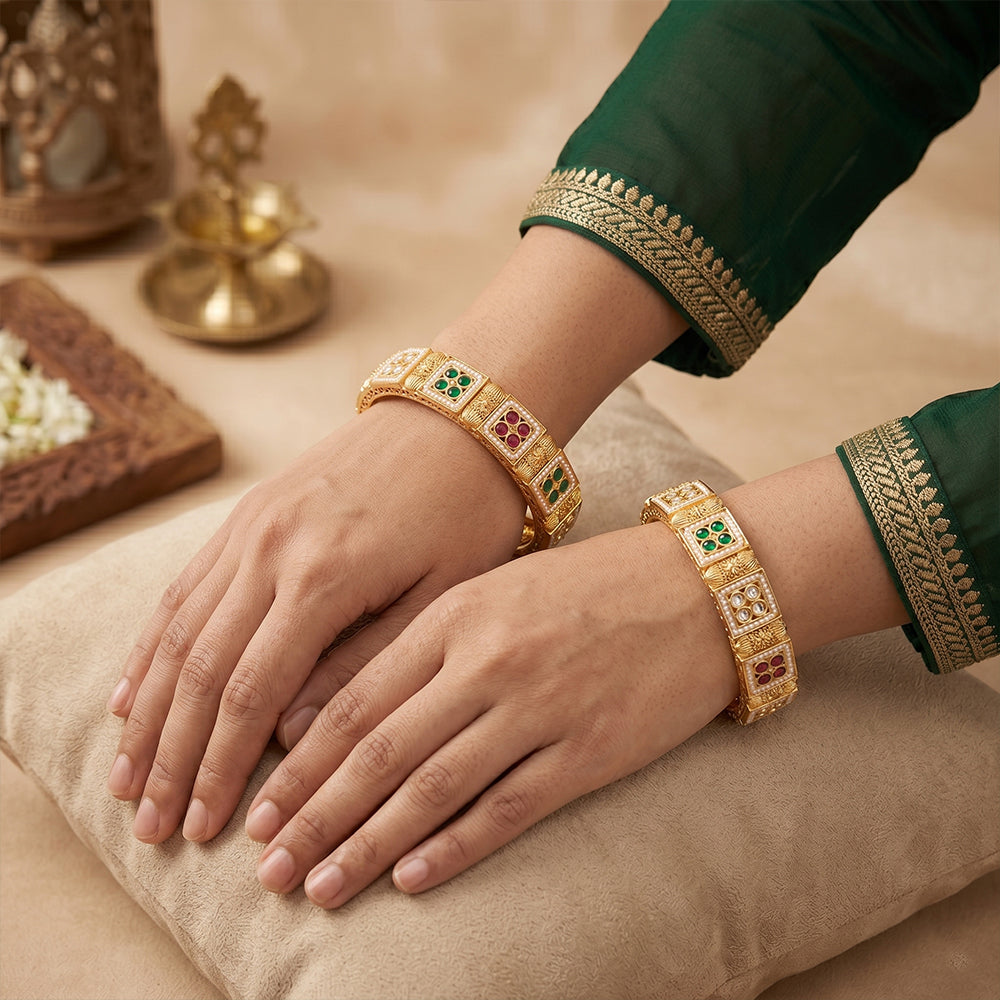 Antique high gold bangle set detailed with prominent square stones.