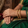 Antique gold plated bangles with delicate and intricate jali craftsmanship