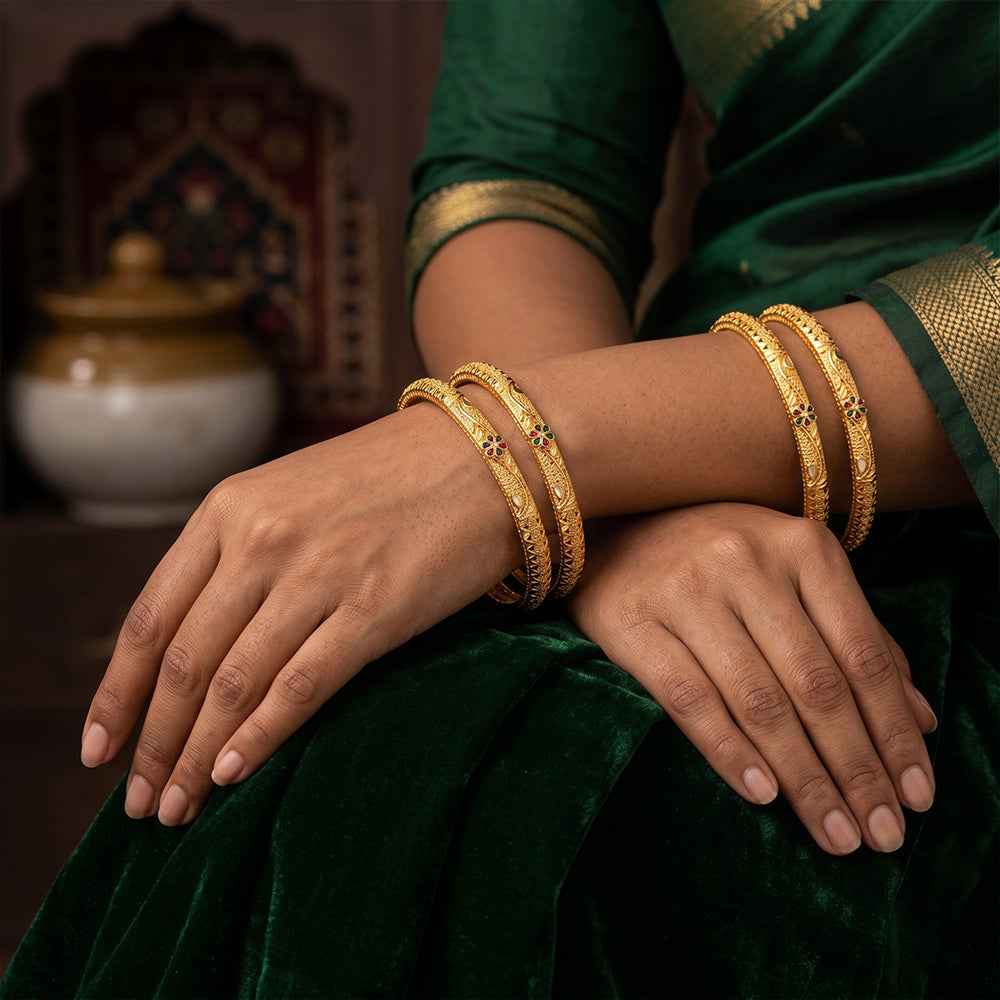 A set of antique-finish bangles with delicate floral engravings for women