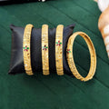 Close-up of premium fancy ethnic bangle set for women in traditional gold-toned finish