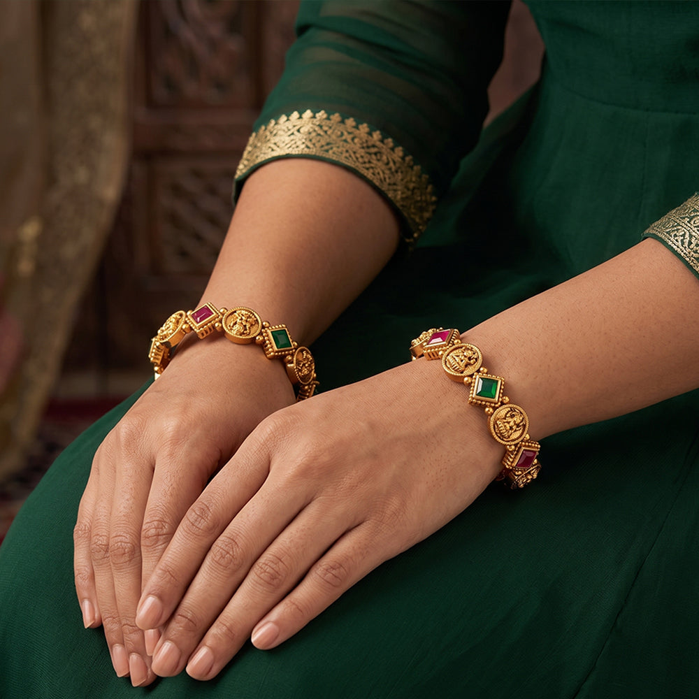 Premium temple style coin bangles featuring traditional gold-tone motifs