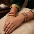 Traditional ethnic high gold kemp bangle set with vibrant stone embellishments for festive wear