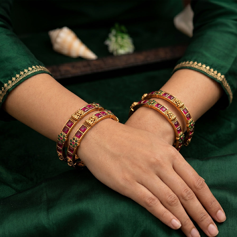 Ethnic high gold temple bangle set featuring intricate traditional motifs