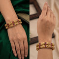 Antique Indian temple carving designer bangle set with intricate gold-toned traditional detail