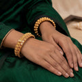 Set of antique gold coin design temple bangles for traditional Indian outfits