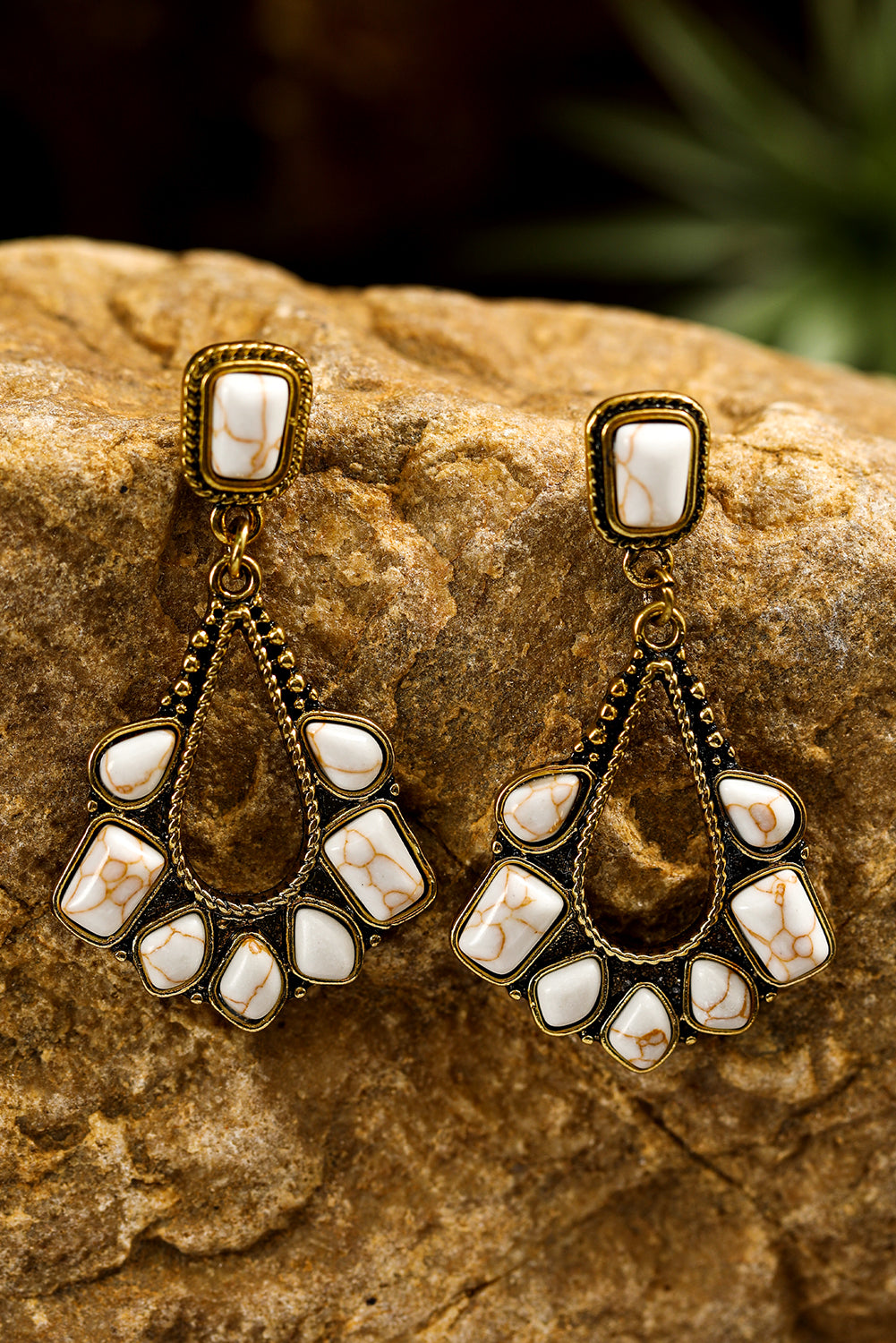 A pair of White Turquoise Inlay Cut Out Western Dangle Earrings with antiqued gold-tone metal accents, displayed on a product card.